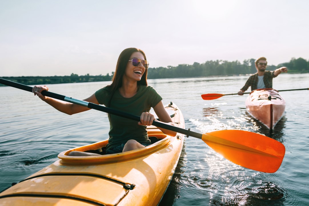 Couple,Kayaking,Together.,Beautiful,Young,Couple,Kayaking,On,Lake,Together